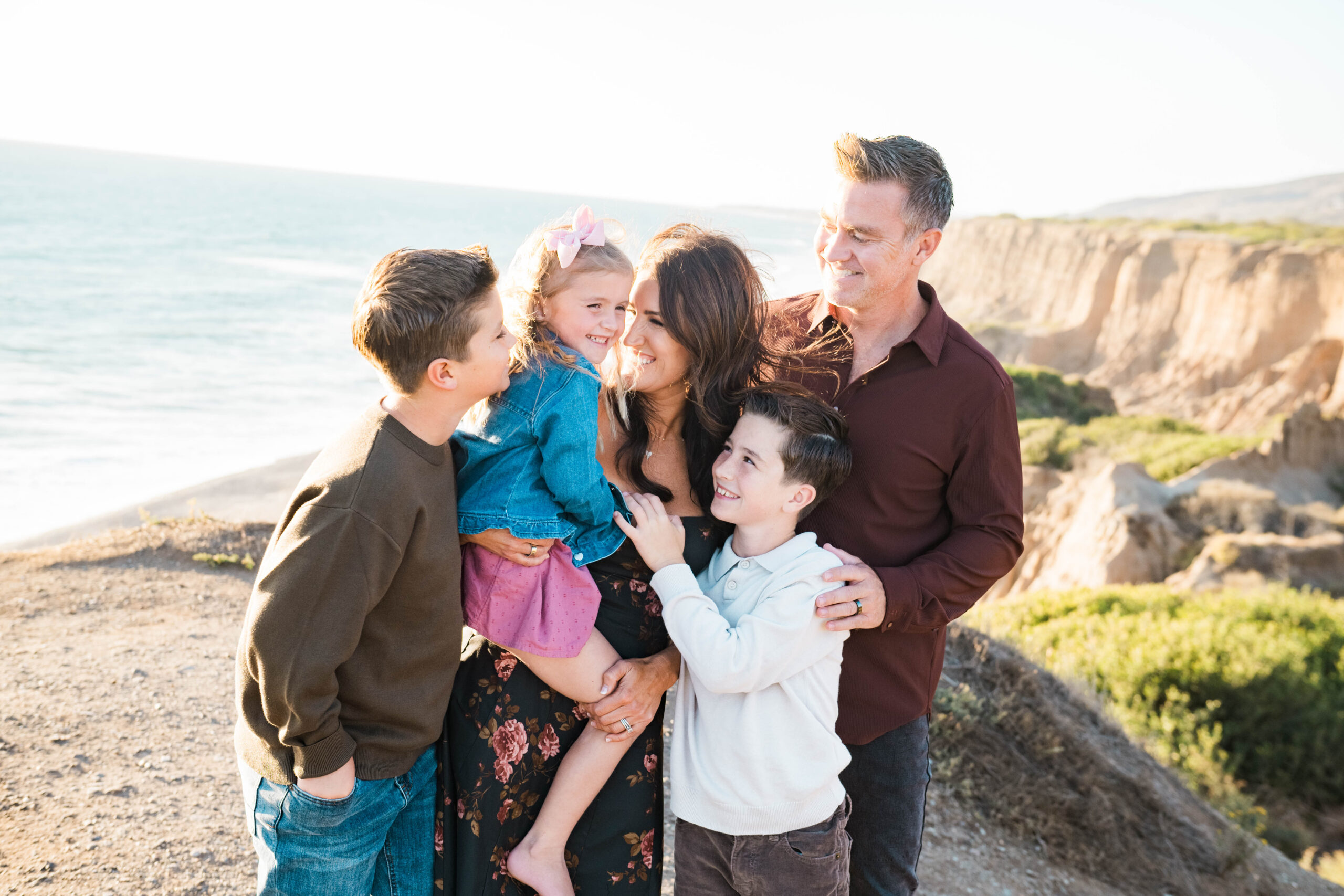 Family hugging during a Southern California summer family session