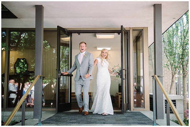 Newly weds exiting temple rooke Bakken | Utah Wedding Photographer