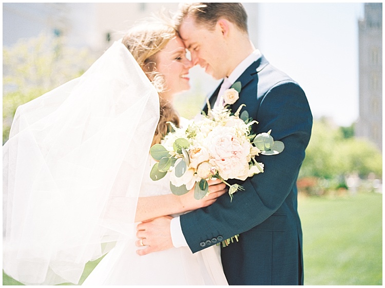 Bride and groom together on temple grounds | Brooke Bakken | Utah Wedding Photographer