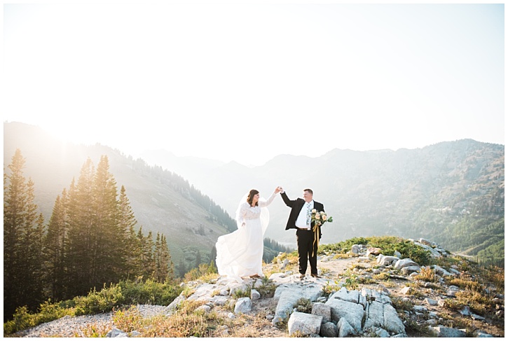 Whitney and Brian during bridal shoot holds hands in the air with sunlit backdrop | Brooke Bakken | Utah Bridal Photographer