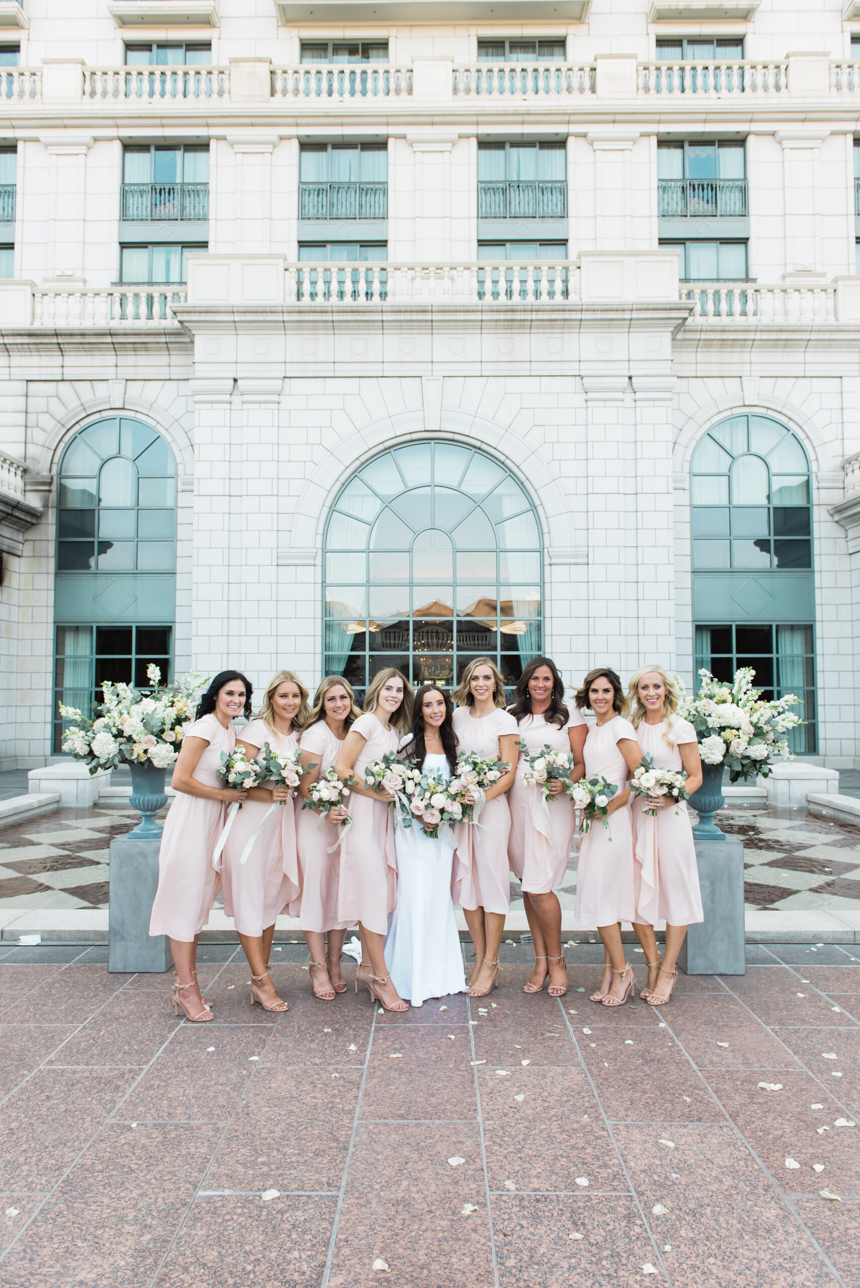 Bride and bridesmaids in pink dresses and nude heels