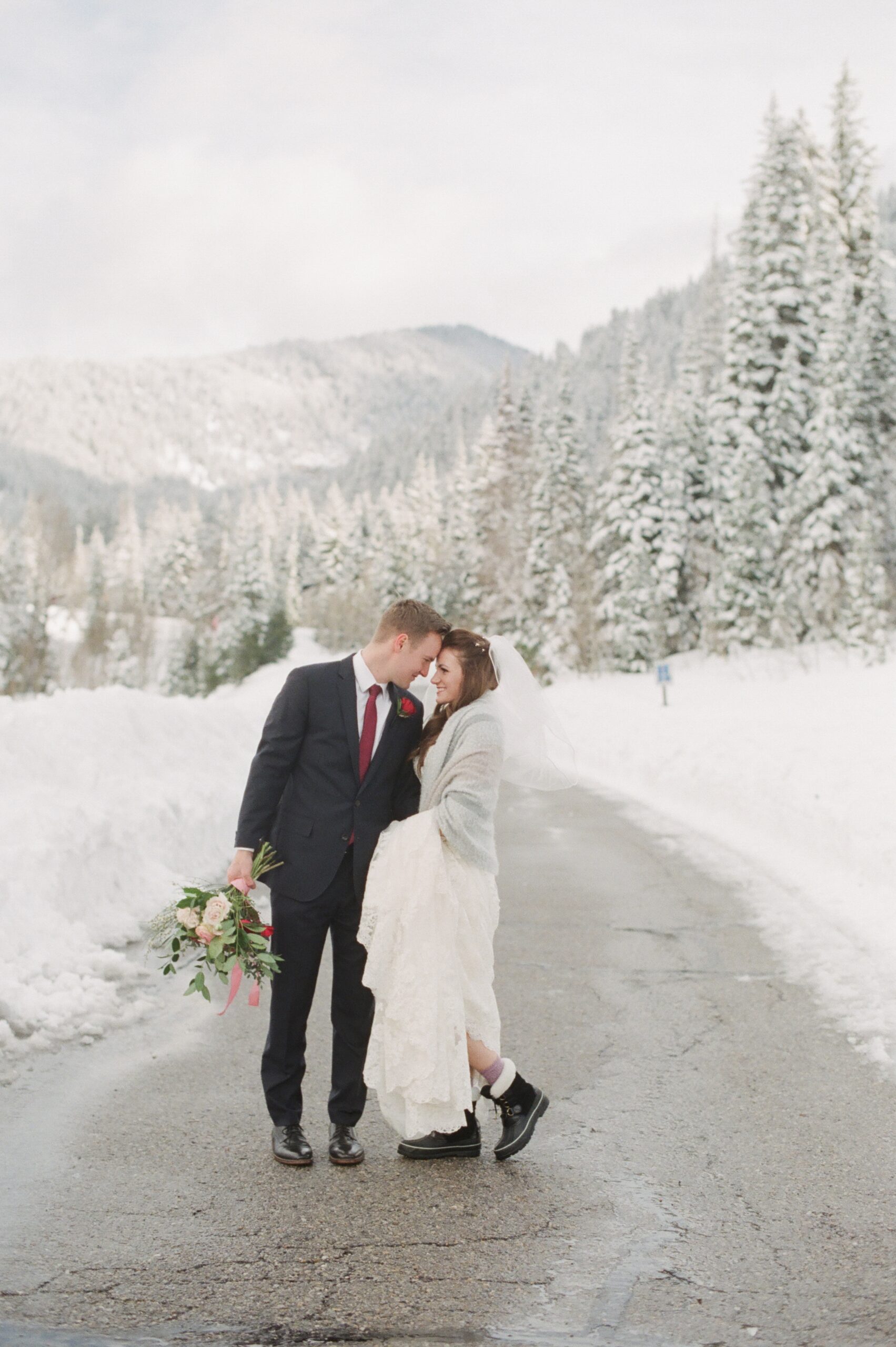 Utah winter photographer tips for bridals in the snow. Bride in snow boots and shawl