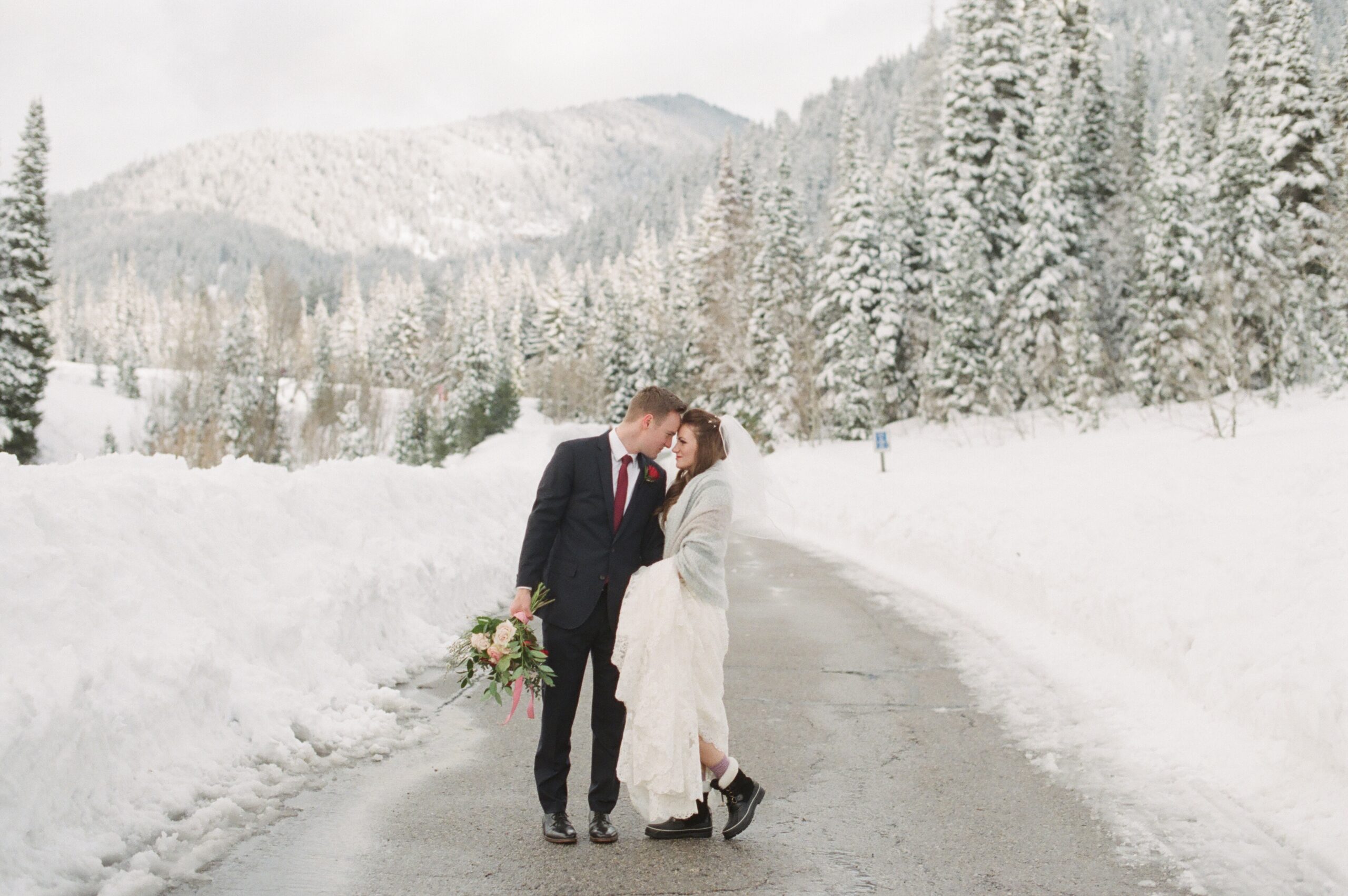 Utah winter photographer tips for bridals in the snow. Bride in shawl and snow boots